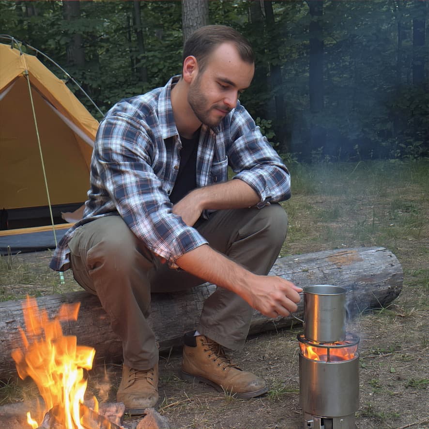 Man at a campfire in the forest — example of a lifestyle shot for a dating profile