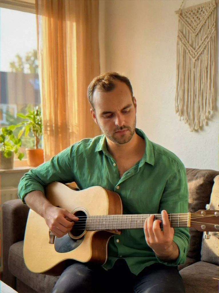 Sample AI dating photo — playing guitar