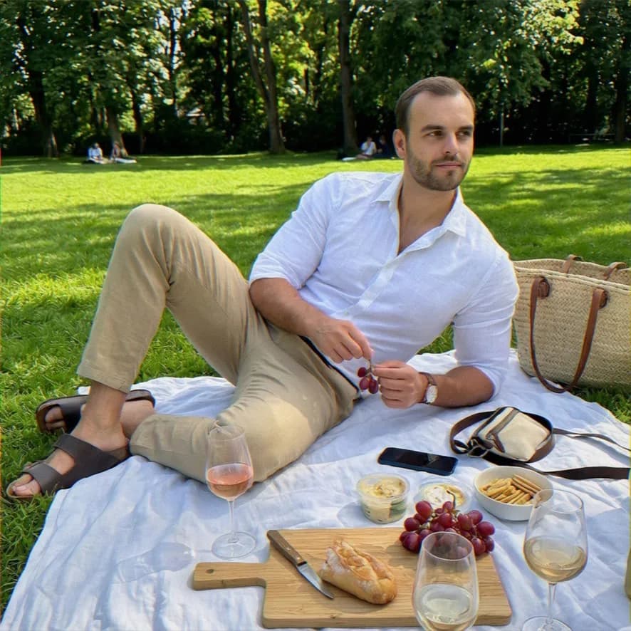 Sample AI dating photo — picnic in the grass